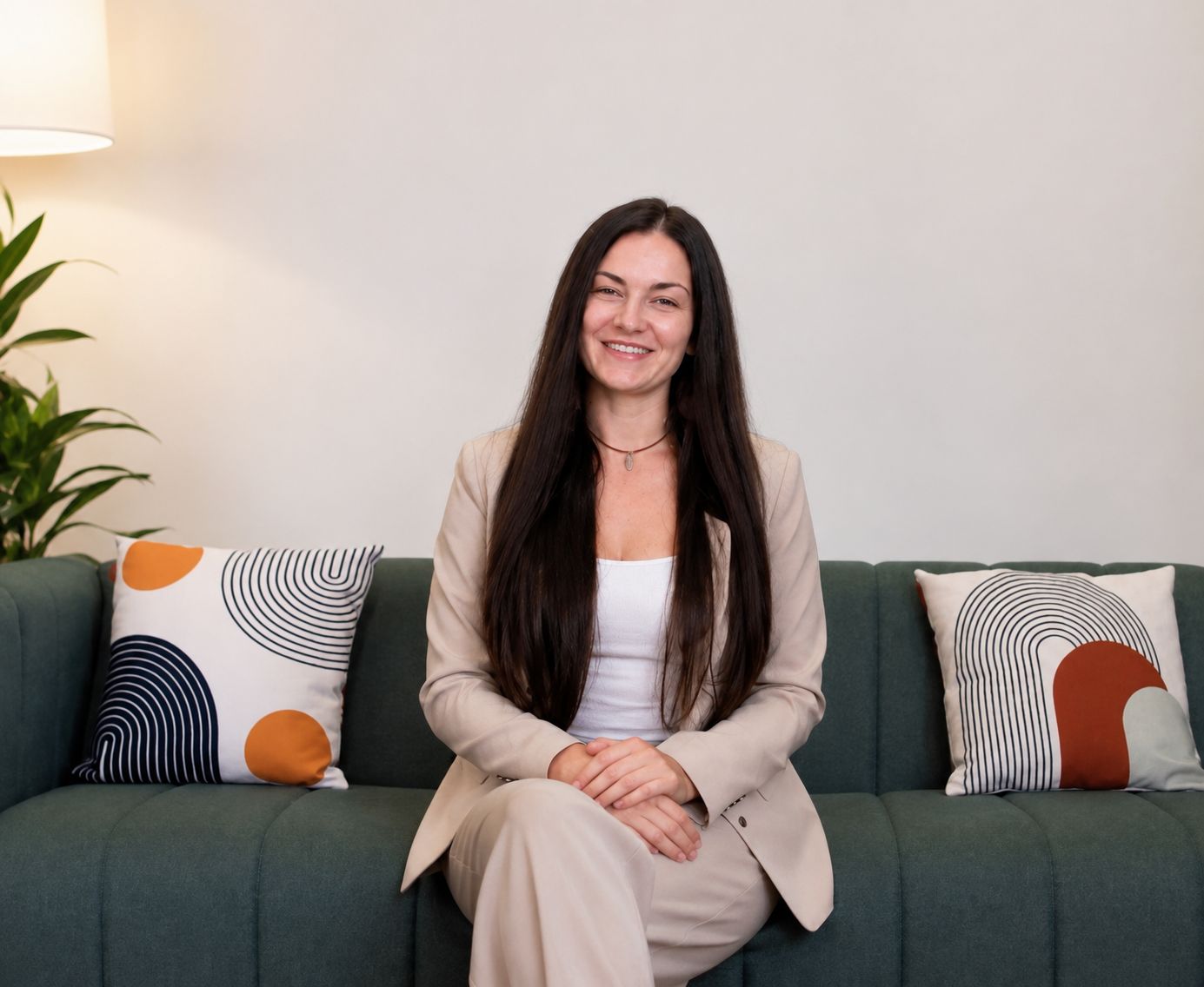 Beth Harvey RD, MNutr, seated on a sofa in a professional setting